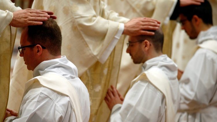 Deacons being ordained to the priesthood