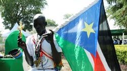 Carrying South Sudan's flag during national day of prayers for peace.