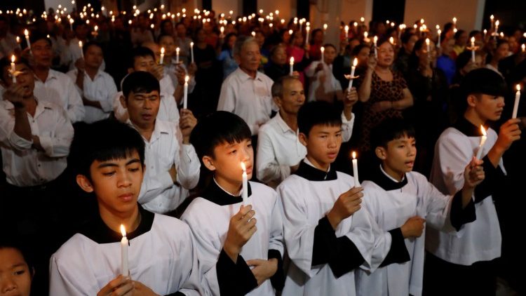 Catholics attend a mass prayer for 39 people found dead in the back of a truck near London, UK at My Khanh parish in Nghe An province