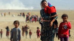 Yazidis fuyant l'arrivée de Daech, le 11 août 2014. 