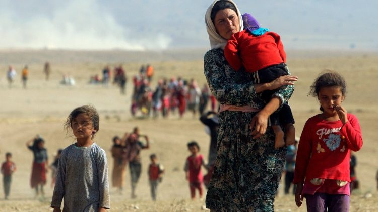 Yazidis fuyant l'arrivée de Daech, le 11 août 2014. 