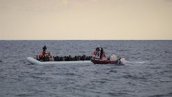 Migrants on a boat of the coast of Libya