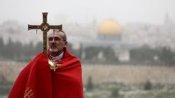 Archbishop Pierbattista Pizzaballa leads a prayer service on Mount Olivet on Palm Sunday