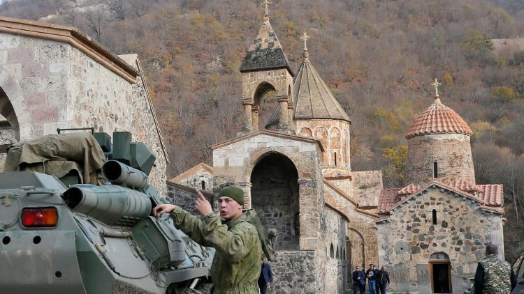 A Russian peacekeeper next to a military vehicle at the Dadivank, an Armenian Apostolic Church monastery in a territory turned over to Azerbaijan according to the 10 November deal
