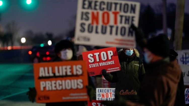 Activists in opposition to the death penalty gather to protest the execution of Lisa Montgomery