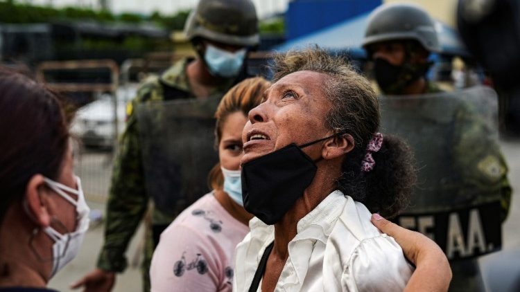 A woman reacts outside a prison where inmates were killed during a riot that the government described as a concerted action by criminal organisations, in Guayaquil