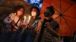 Colombian women participate in a vigil to demand respect for the lives of protesters