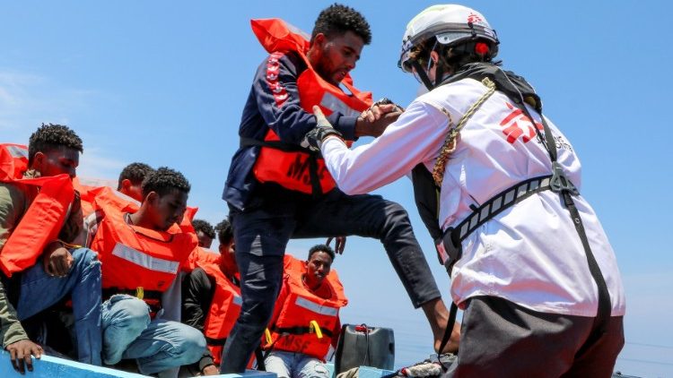A MSF rescue mission helps migrants off a boat in the Mediterranean near Malta