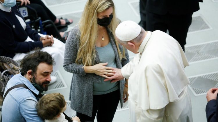FIle photo of Pope Francis blessing pregnant woman's unborn child
