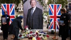 Tributes for Sir David Amess  outside the Houses of Parliament in London after he was stabbed to death on 15 October 2021