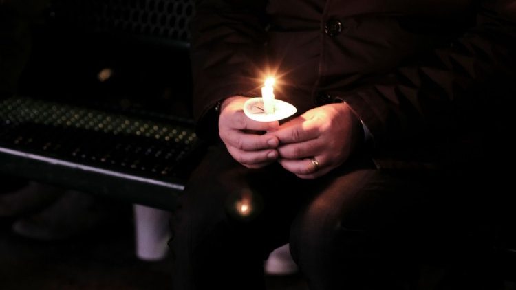 Residents attend a candlelight vigil in remembrance of the victims