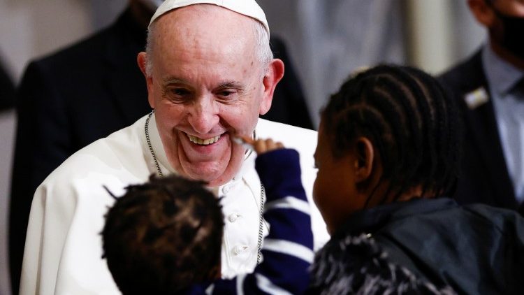 Pope Francis greets a migrant family during an ecumenical prayer event  in Nicosia, Cyprus.
