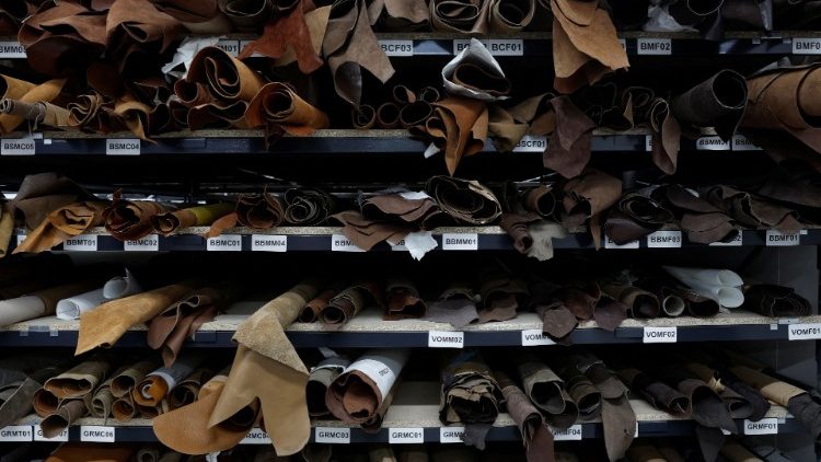 Produced leather sits in shelves at a workshops in Paris