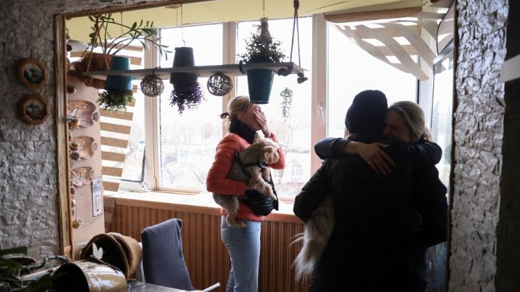 Family in Ukraine seeking shelter indoors