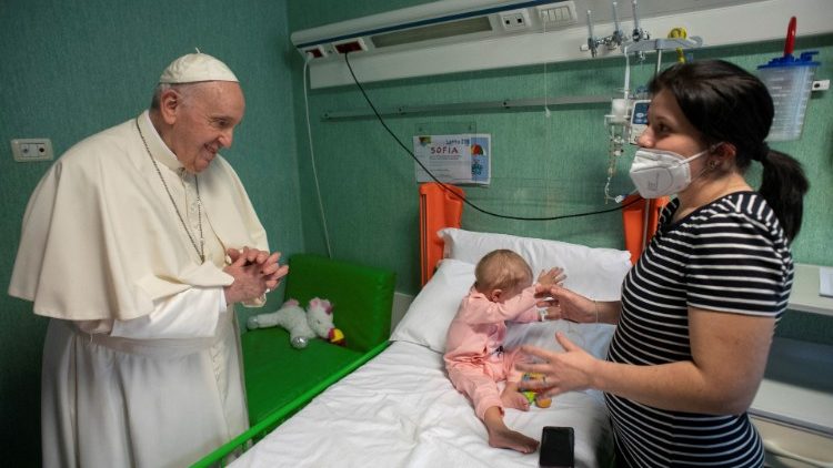 Pope Francis gazes at a Ukrainian baby who fled the war