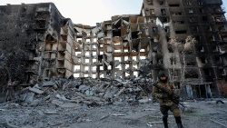 A destroyed apartment building in the city of Mariupol