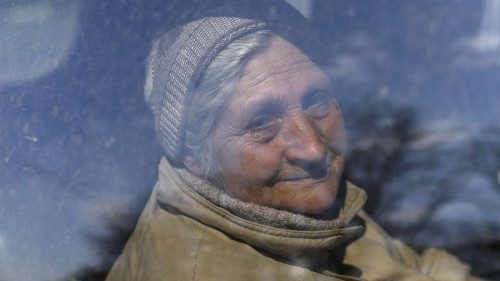 An elderly woman is evacuated from the city of Kharkiv in Ukraine