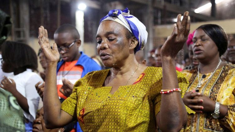 Catholics attend Mass in St. Charles parish in Kinshasa ahead of the Pope's visit