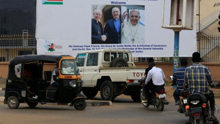 Bilboard pokazujący Papieża Franciszka, abp. Justina Welby'ego i Iaina Greenshieldsa, Dżuba, stolica Sudanu Południowego, 1 lutego 2023