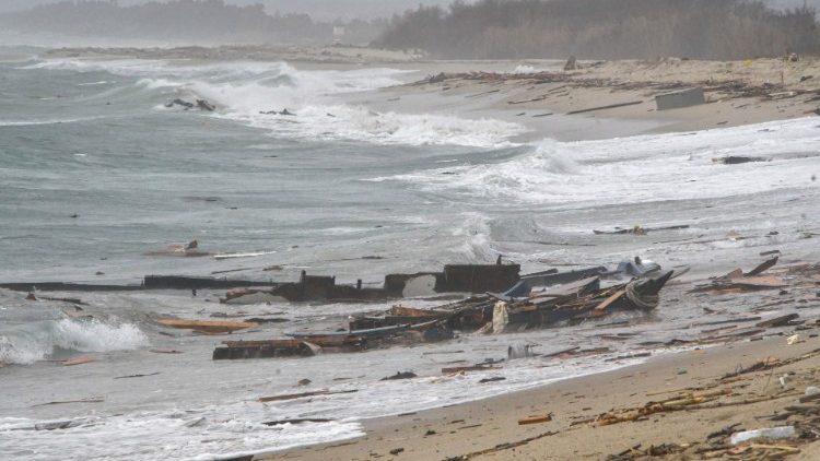 Remains of a ship along the beach where bodies believed to be of migrants were found