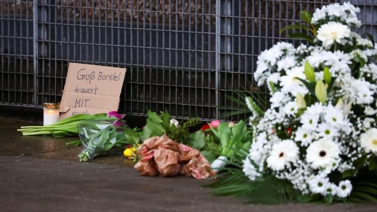 Flowers brought to the site of the shooting to pay tribute to the victims