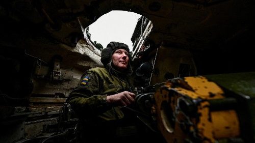 Ukrainian serviceman looks on inside a tank at a position near a frontline in Zaporizhzhia region