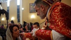 Christian worshipers attend an Easter mass at the Armenian church in Baghdad