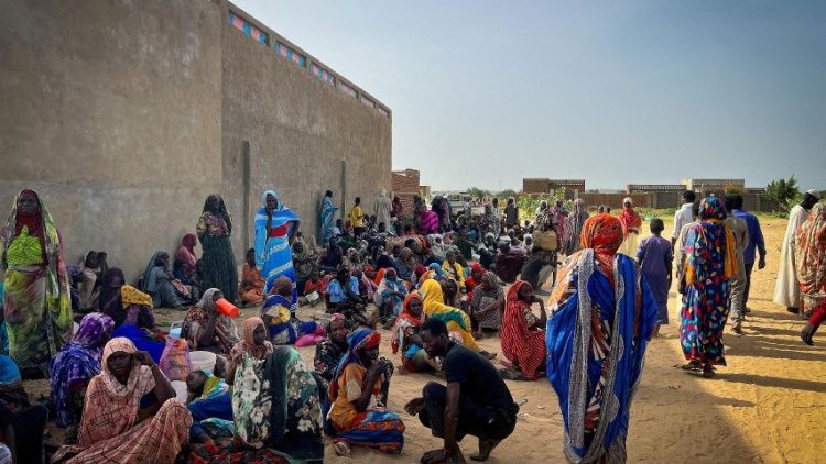Sudanese refugees gather outside Adre Hospital in Chad