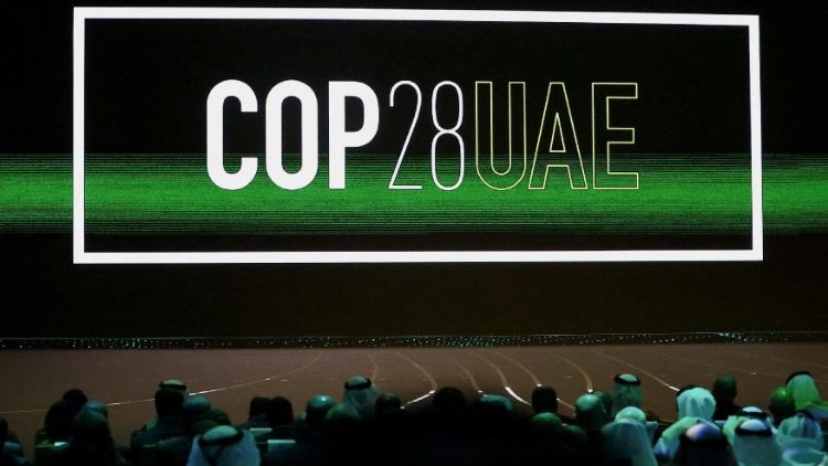 FILE PHOTO: 'Cop28 UAE' logo is displayed on the screen during the opening ceremony of Abu Dhabi Sustainability Week (ADSW) under the theme of 'United on Climate Action Toward COP28', in Abu Dhabi