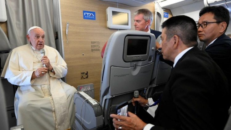 Pope Francis holds a press conference aboard the papal plane returning from Mongolia