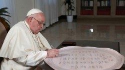 Pope Francis signs a unified faith declaration on climate action as part of the inauguration of the "Faith Pavilion" during COP28 in Dubai, at Casa Santa Marta