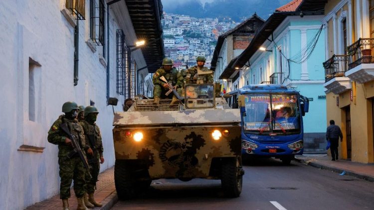 Security forces patrol after an outbreak of violence in Quito
