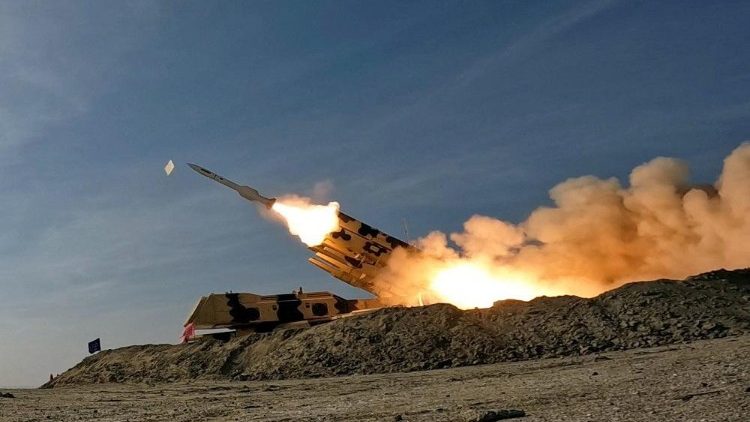 A missile is launched during a military exercise in an undisclosed location in the south of Iran