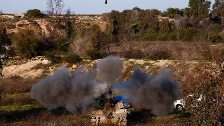 An Israeli artillery unit fires towards Gaza, near the northern Gaza Strip border