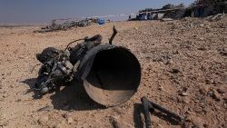 The remains of a rocket booster that, according to Israeli authorities critically injured a 7-year-old girl, after Iran launched drones and missiles towards Israel, near Arad
