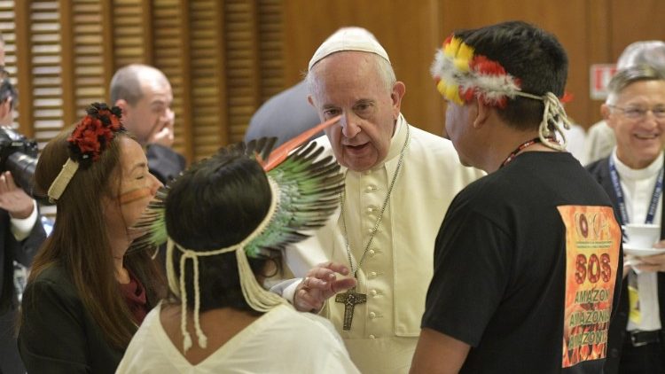 Pope Francis with the indigenous leader in the general congregaion of the Amazon synod