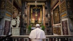 Pope Francis prays before the miraculous crucifix at the church of San Marcello on the Corso