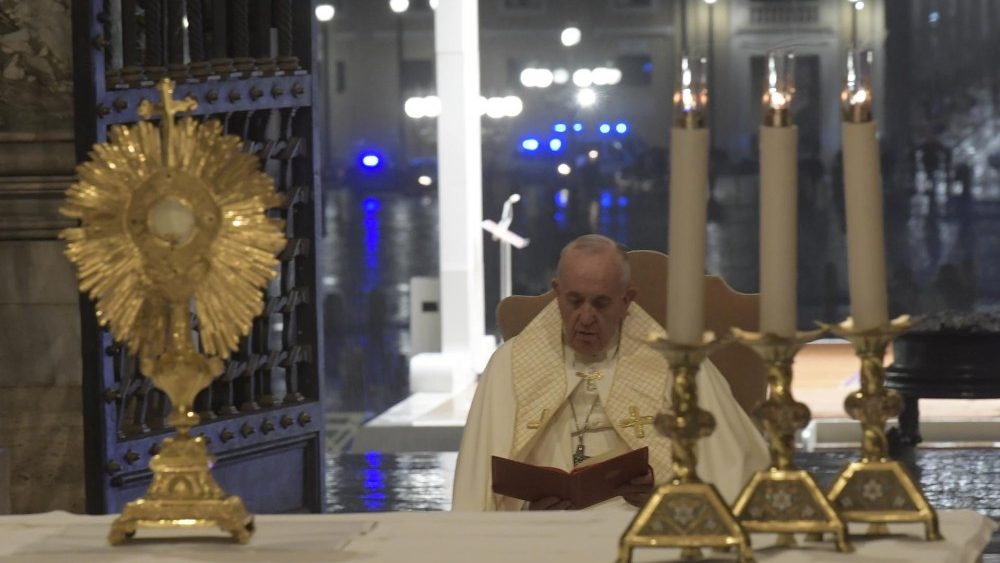 Pope Francis prays before the Blessed Sacrament