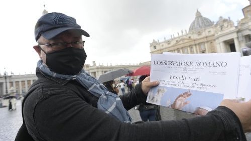 Member of the faithful in St Peter's Square holding the new Encyclical "Fratelli tutti"