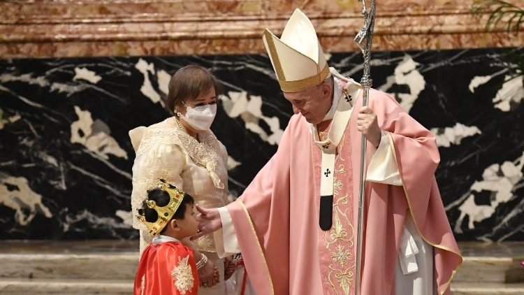 Pope Francis greets a Filipino child