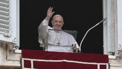Pope Francis waves to the crowd gathered in St Peter's Square for the Sunday Angelus
