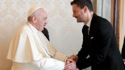 Pope Francis shakes hands with Eduard Heger, Prime Minister of Slovakia