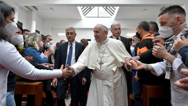 Pope Francis greets the inmates