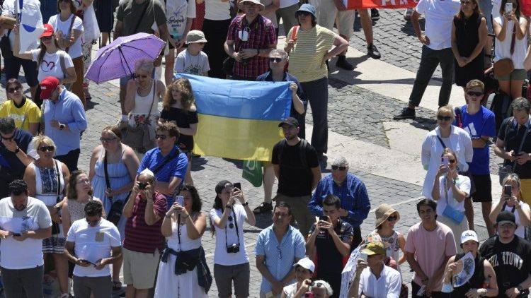 A Ukrainian flag held up by the faithful gathered in St. Peter's Square