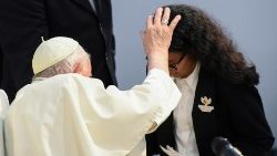 Pope Francis blesses a young student during his visit to Bahrain in November 2022