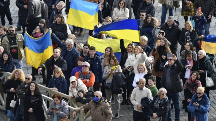 Ukrainian flags held aloft in St. Peter's Square
