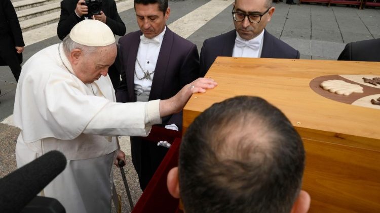 Pope Francis prays over the casket of the late Pope Emeritus Benedict XVI