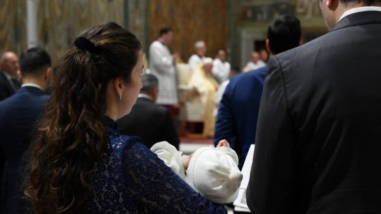 The Pope baptises babies in the Sistine Chapel