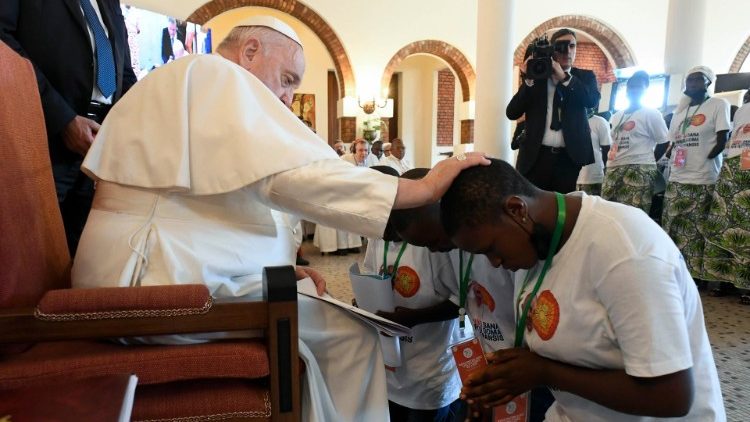 Pope Francis with one of the witnesses during the encounter with survivors