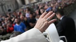 Pope Francis greets the faithful during Mass on Palm Sunday 
